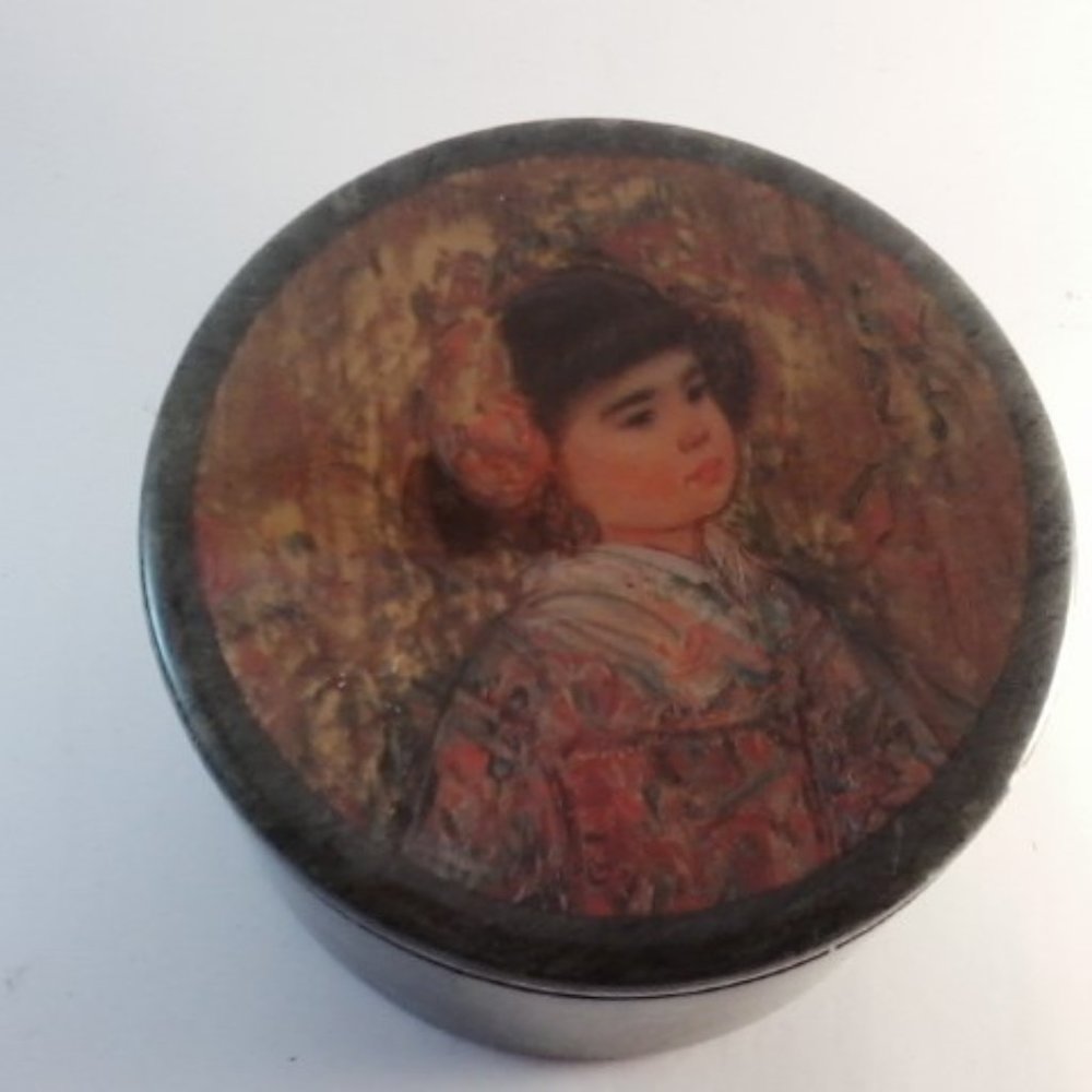 Heavy green trinket box with image of a young girl on lid